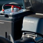 Battery connected to electric outboard motor.