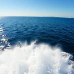 Starboard side of a boat on open water.