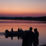 Distressed parents mourn near a rescue boat.
