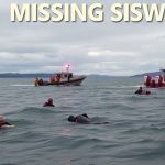 Rescue team searching water near Everett, WA for missing boaters.
